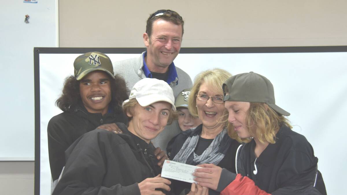 GRINS: Brendan Nean, Jack Dimmock, Bernie Shakeshaft, Blake Rowe, Robyn Wood, Jarell Russell-Pitt are delighted with the cheque. Photo: Nicholas Fuller