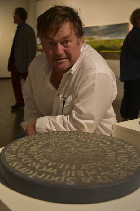 SCULPTOR: Ian Marr with one of his medallions. Photo: Supplied.