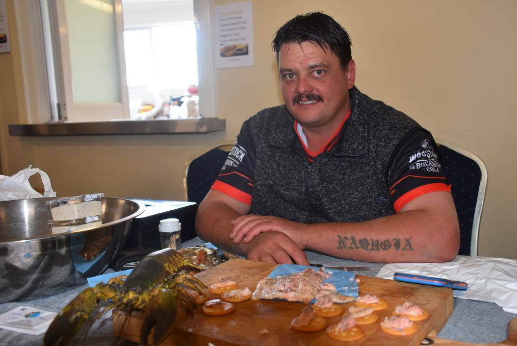 Deano Williams, selling his smoked trout and yabbies at last year's market. Visitors can tour his fish farm on Sunday. Photo - Nicholas Fuller