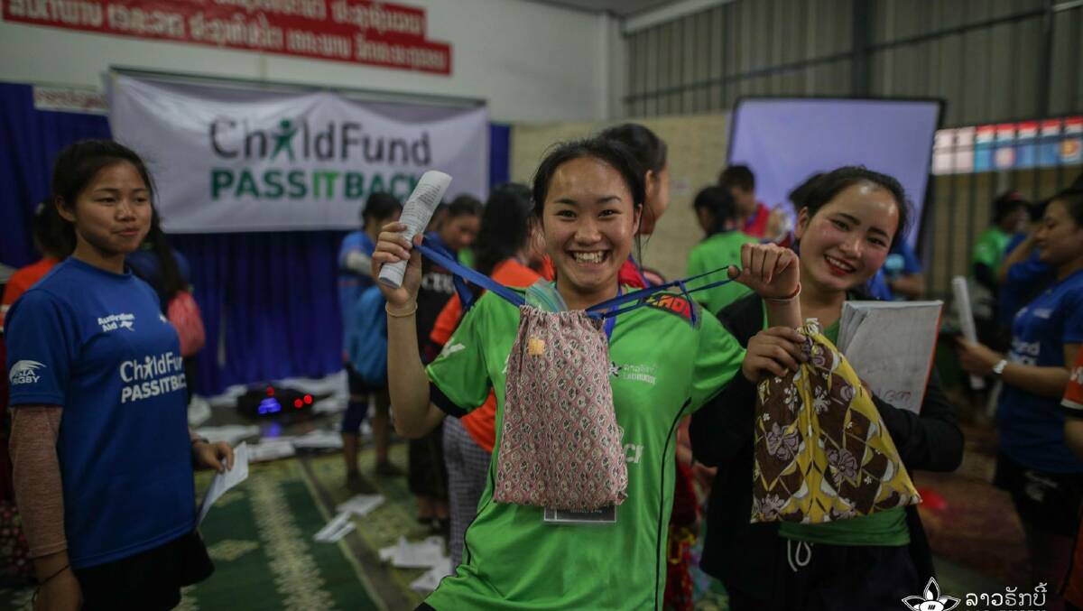 A Lao girl delighted with her bag from the Armidale Days for Girls group.