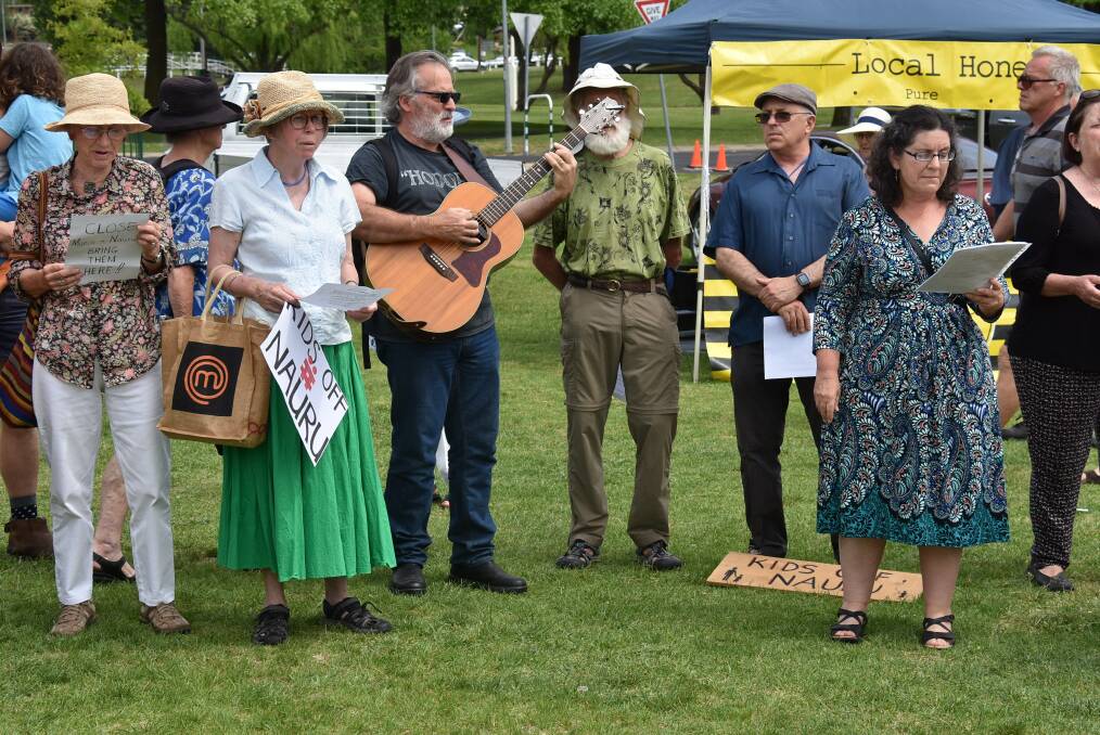 PROTEST: Gaynor McGrath (second from left) and Dr Frances Tafra (right) were among 30 members of a flash mob for Nauru refugees on Sunday. Photo: Nicholas Fuller