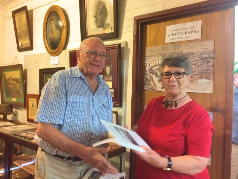 Georgie Frogley of Don Dorrigo & Guy Fawkes Historical Society presents
John Lean with a complimentary copy of the first addition of the
Settlers of the Guy Fawkes