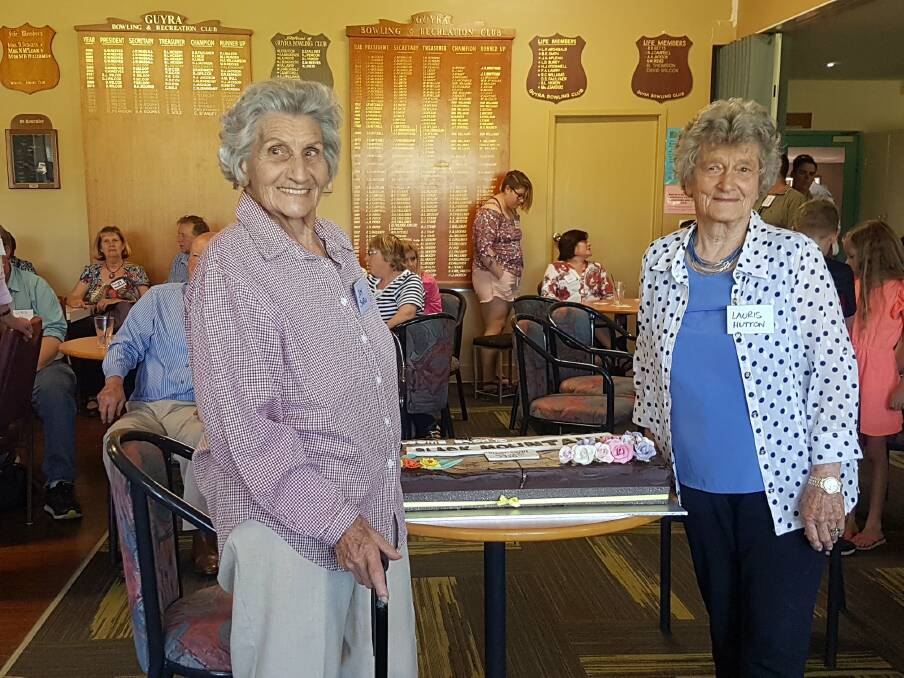 LET THEM HAVE CAKE: Joy Snell and Lauris Hutton cutting the cake. Photo: Supplied
