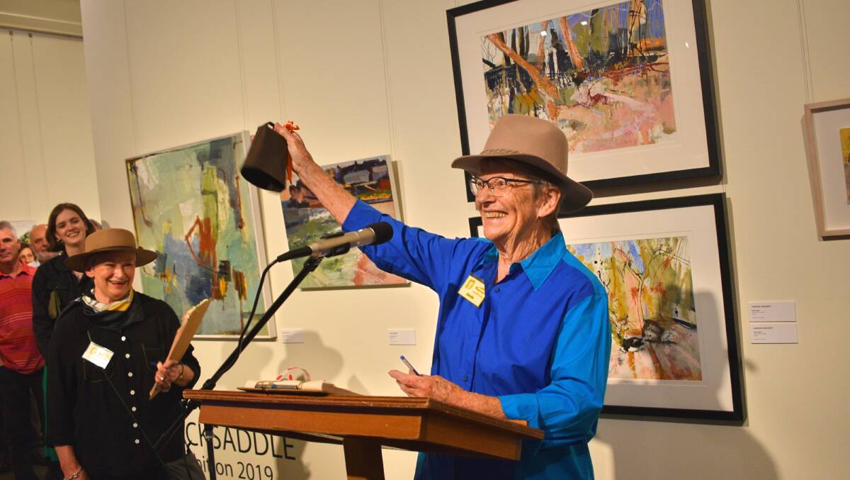 IT TOLLS FOR THEE: Packsaddler Glenda Kupczyk-Romanczuk rings the bell to open the exhibition. Photo supplied.