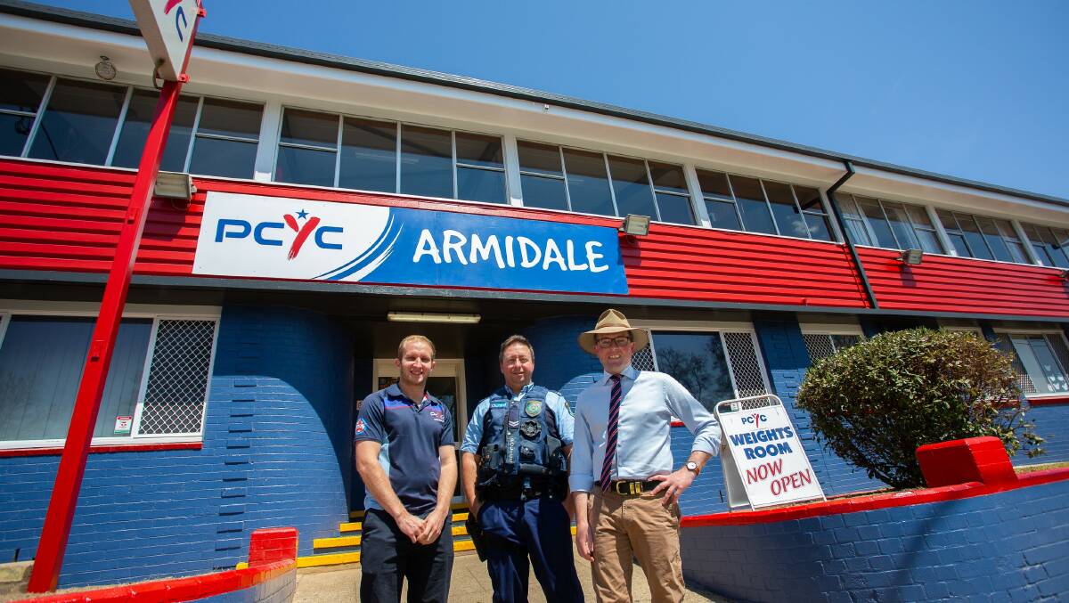 RED, WHITE, AND BLUE: Armidale PCYC Manager Sam Davis, Senior Constable Darren Griggs, and Northern Tablelands MP Adam Marshall outside the new and bright PCYC faade. Photo supplied.
