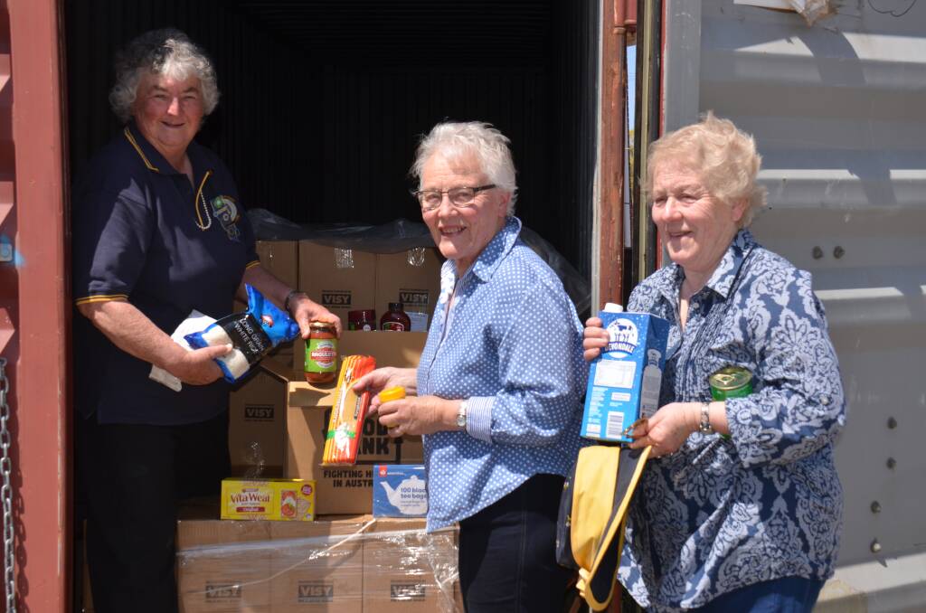 FOOD DONATIONS: Lorraine Sewell, from CWA Kellys Plains - Dangarsleigh, Heather Starr, from CWA Guyra, and Dot Lockyer, from the Guyra & District Historical Society & Museum. Photo: Nicholas Fuller.