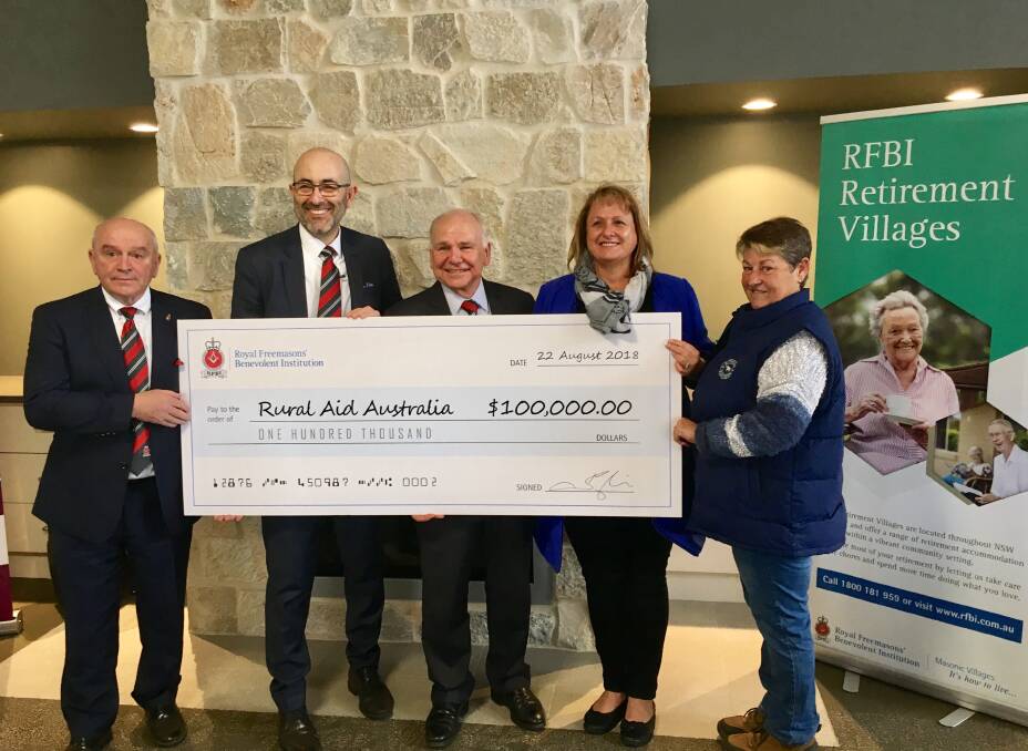 DONATION: RFBI chairman David Adams presented a cheque for $100,00 to Rural Aid Australia's Tracy Alder in Dubbo.