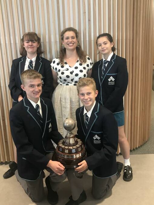 VICTORY: Rubi Ainsworth, Fiona Smee, Ella Vu (back), Fynn Eastwood and Casey Rainger (front) with the debating trophy. Picture supplied.