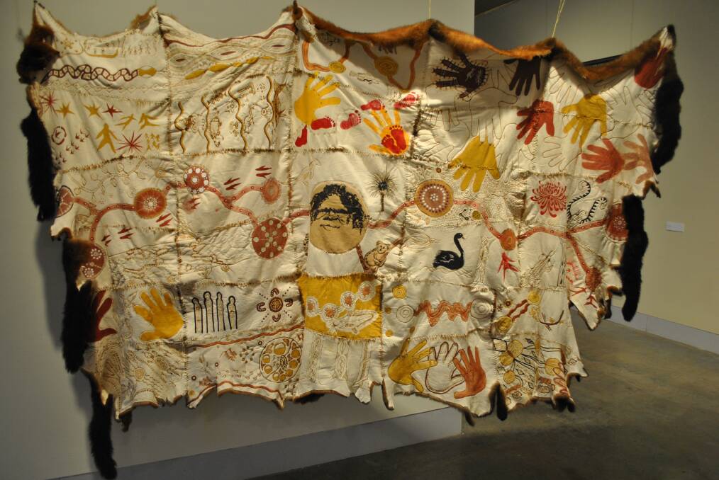 The Myall Creek Gathering Cloak, made by Carol McGregor with Adele Chapman-Burgess, Avril Chapman and the Community of the Myall Creek Gathering Cloak, 2018, natural ochre, thread on possum skins. Picture supplied by NERAM.