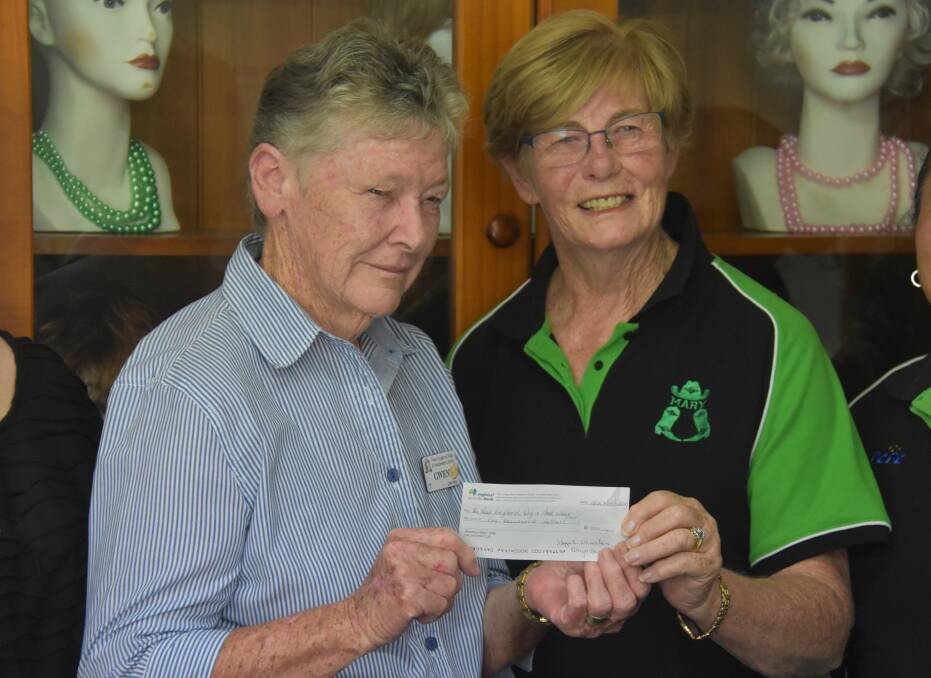 GRAND: Gwen Hodson receives the cheque from Hazel Charles. Photo: Nicholas Fuller