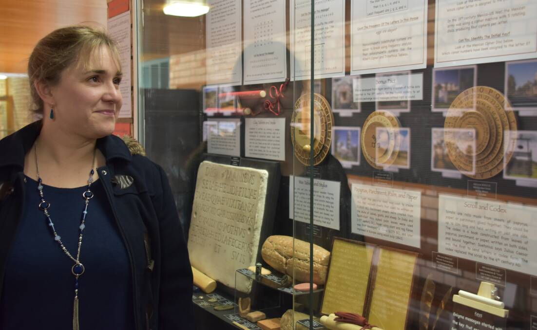 ENIGMA-TIC: Dr Bronwyn Hopwood, curator of the UNE Museum of Antiquities, puzzles over the case. Photo: Nicholas Fuller