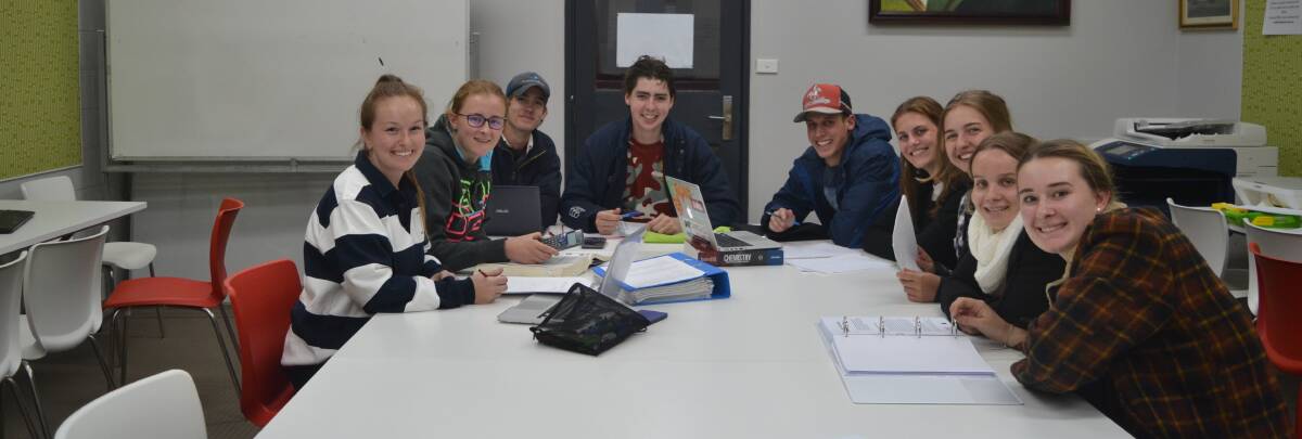 YOUNG SCIENTISTS: Kelsey Buss (centre) with students at St Albert's College, UNE. Photo supplied.