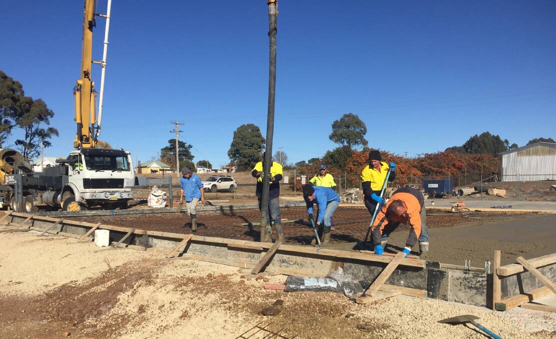 Contractors finish laying the foundation for the new State Emergency Services headquarters in Guyra.