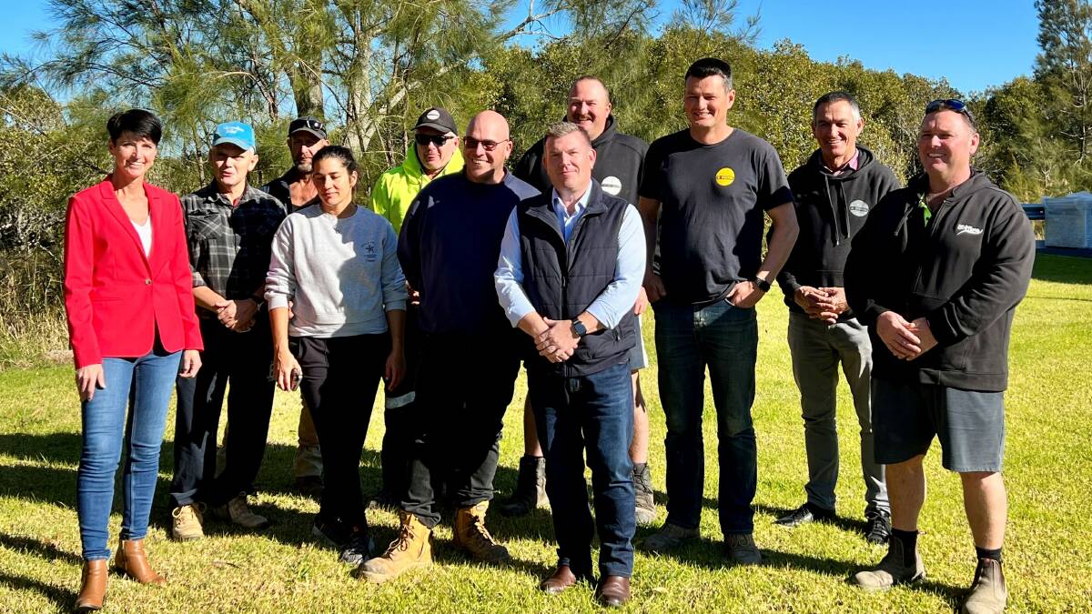 Kate Washington with Minister Duglan Saunders (centre) and Port Stephens Oyster farmers at Taylors Beach on June 16. Picture: Kate Washington