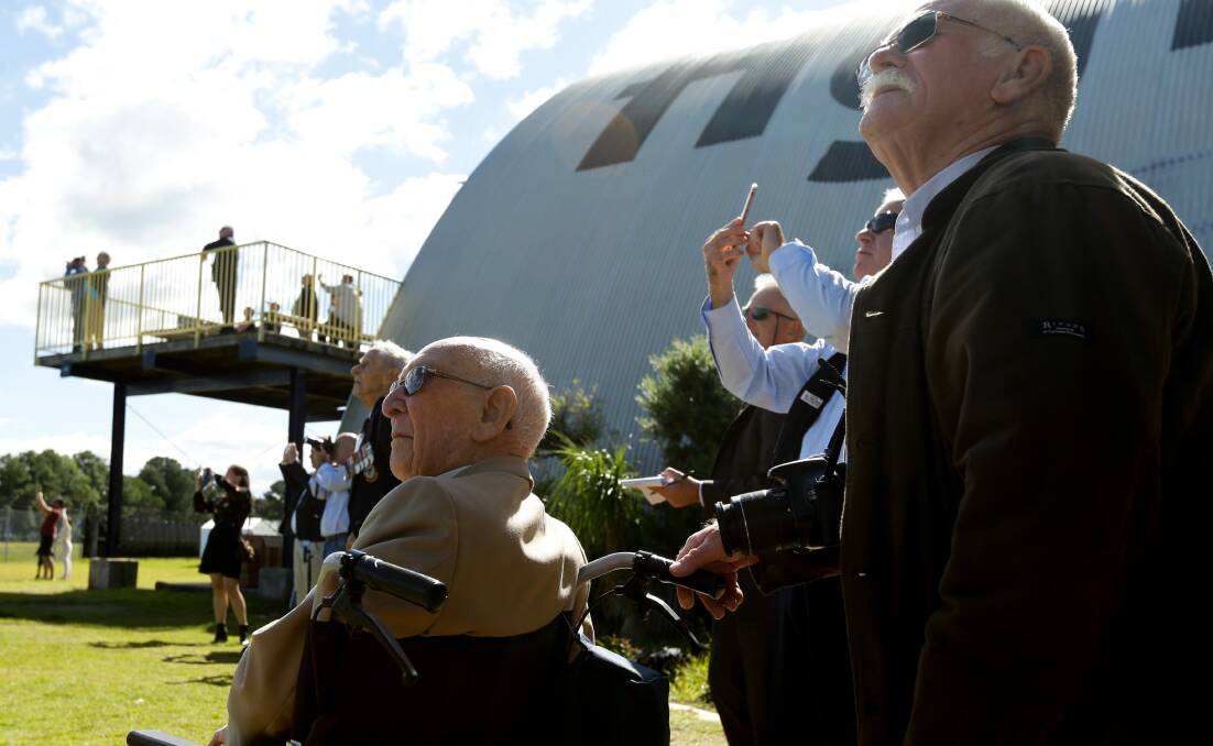 Clem Jones and his son, Chris, watch the aerial display. Picture: Jonathan Carroll 