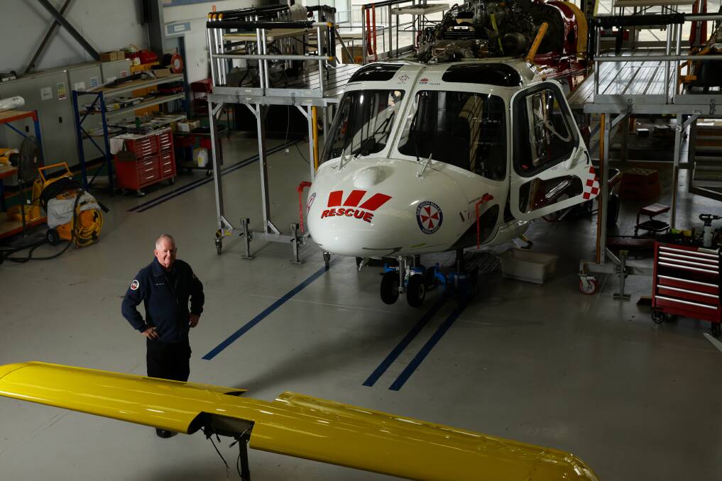 BACK TO BASE: Barry Walton in the Broadmeadow maintenance hangar for the Westpac Rescue Helicopter Service. Picture: Jonathan Carroll 