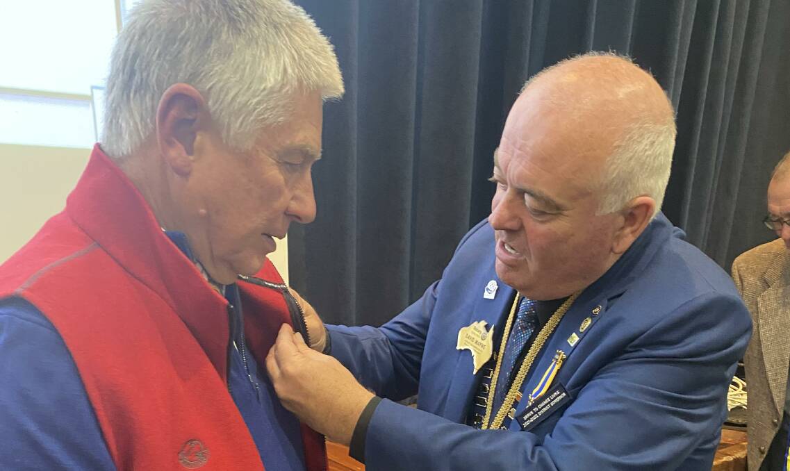 Rotary Club of Armidale member, Peter Lloyd receiving his Paul Harris Fellowship from district governor, David Mayne. Picture: supplied