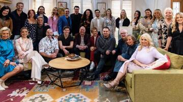 The Neighbours cast pose for a team photo in Melbourne ahead of the show's final episode.