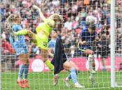 Chelsea's Sam Kerr (r) puts Chelsea ahead in the Women's FA Cup final against Manchester City.