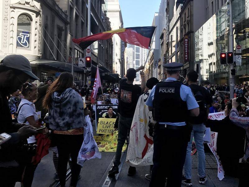 Hundreds have marched in Sydney demanding justice for indigenous people who have died in custody.