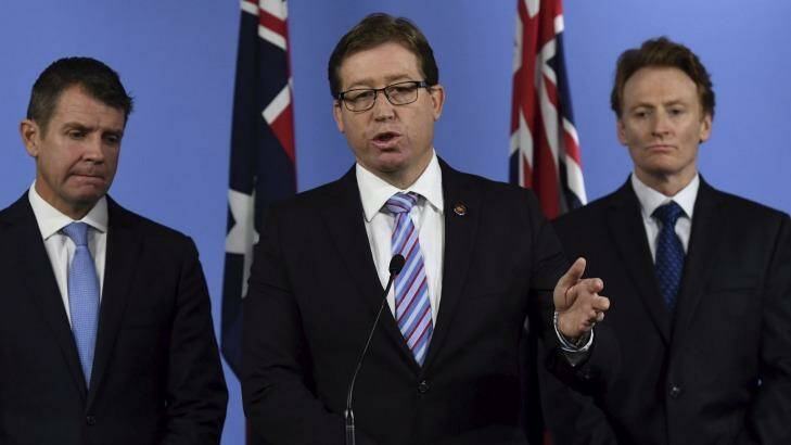 Deputy Premier Troy Grant (centre) during a conference on the report of the Special Commission of Inquiry into the Greyhound Racing Industry.  Photo: Peter Rae