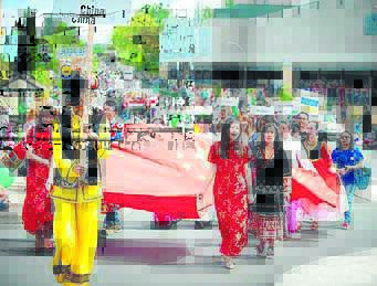 INTERNATIONAL PRIDE: UNE students representing 35 countries taking part in an Armidale Autumn Festival parade.