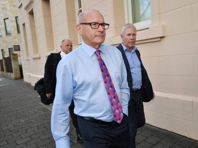 Magistrate Bob Harrap (centre) has resigned after facing deception charges in court.