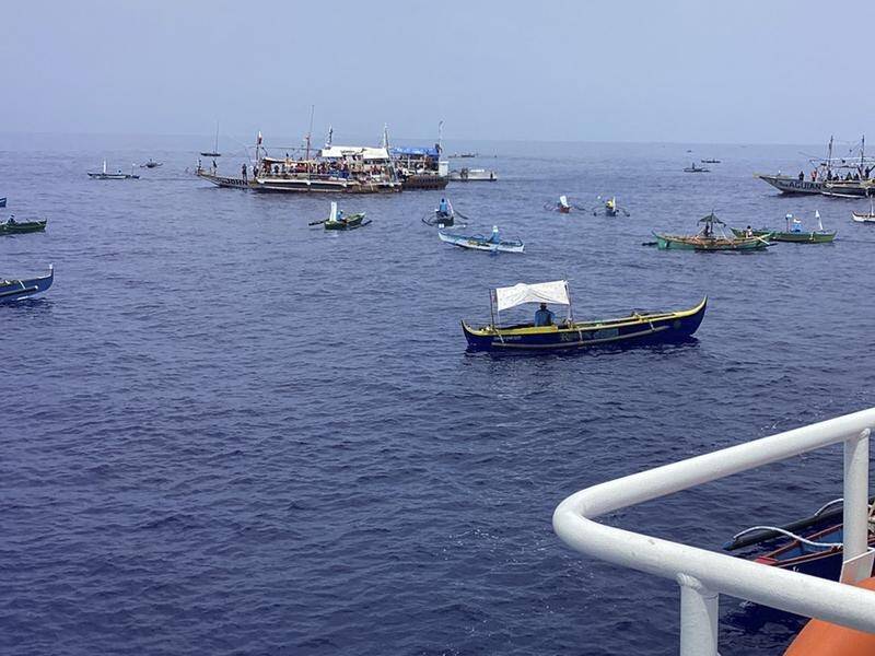 Activists and fishermen are sailing to a shoal that Beijing claims as its own despite a UN ruling. (AP PHOTO)