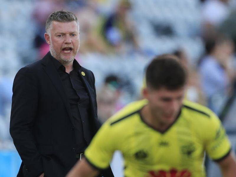 Wellington Phoenix coach Ufuk Talay (l) believes players could be back training by June 1.