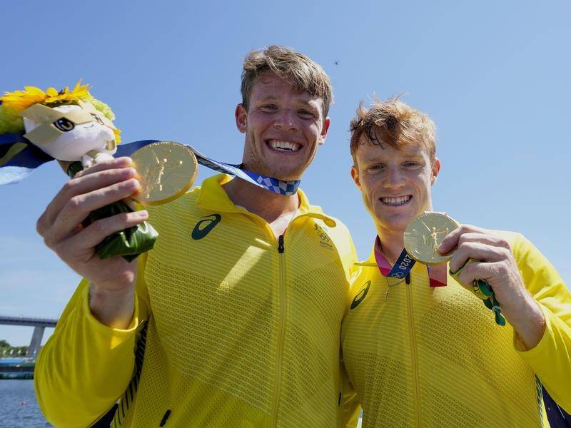 Tom Green and Jean van der Westhuyzen celebrate their upset kayak 1000m gold medal triumph.