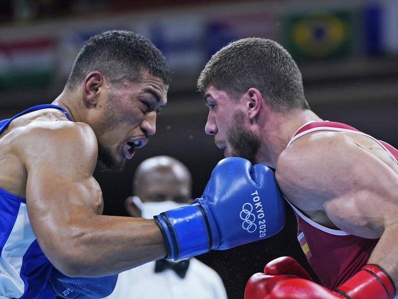 Australia's Paulo Aokuso (l) lost an extremely close Olympic boxing contest to his Spanish rival.