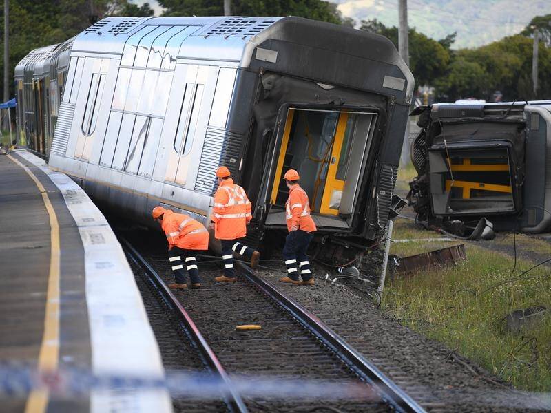 A man is facing a string of charges after a train derailed, leaving four people injured.