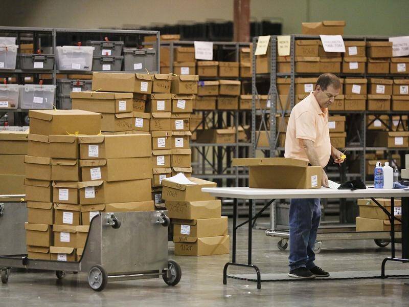 The recount of 5000 more votes is continuing in Florida as a deadline looms in two key races.