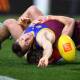Lincoln McCarthy of the Lions reaches for the ball during his side's AFL loss to Melbourne. (Jono Searle/AAP PHOTOS)