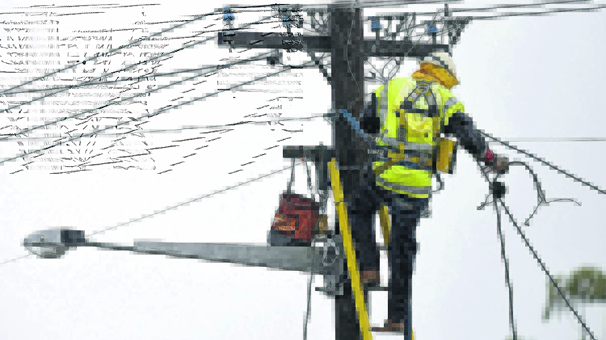 STRAIN: Essential Energy workers needed to maintain the network. Photo: Gareth Gardner