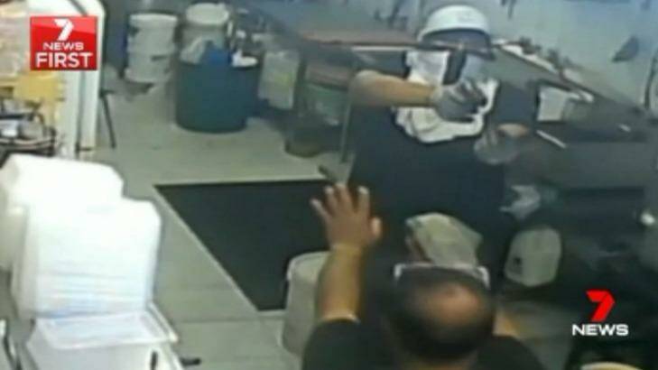 Footage shows the gunman pointing a pistol at Mr Tanvir and the chef, before they were forced into a refrigerated storeroom. Photo: Seven News