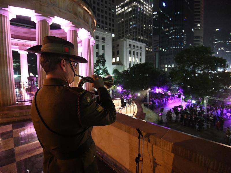 Thousands gathered in the rain for the dawn service at Brisbane's Anzac Square.