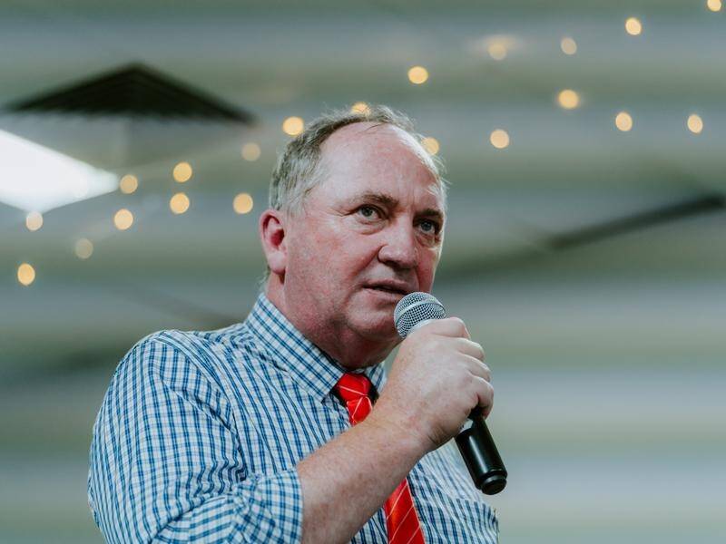 A man has been charged with threatening Nationals leader Barnaby Joyce's security officer.