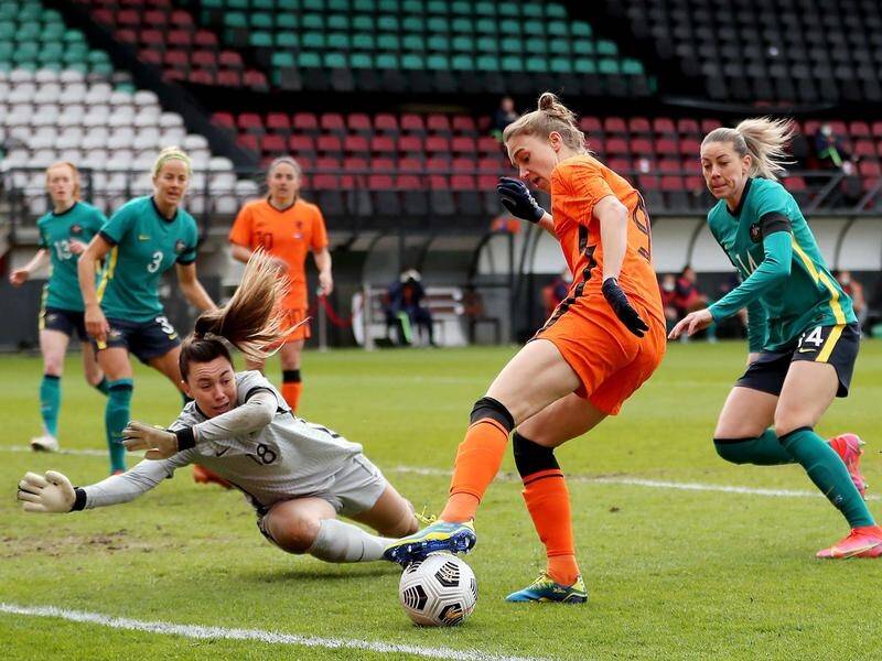 Matildas' goalie Mackenzie Arnold, diving to stop Dutch star Vivianne Miedema, had a tough day.
