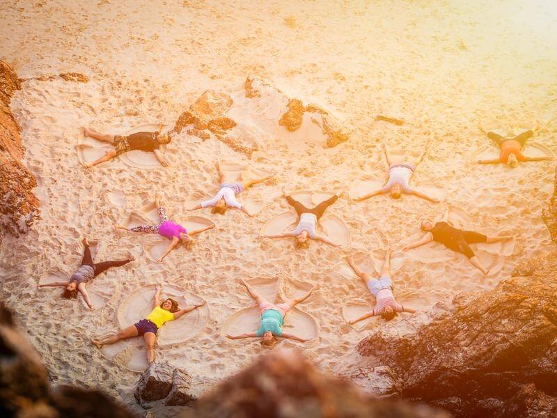 Gold Coasters set to break the world record for Most People Making Sand Angels at Kurrawa Beach