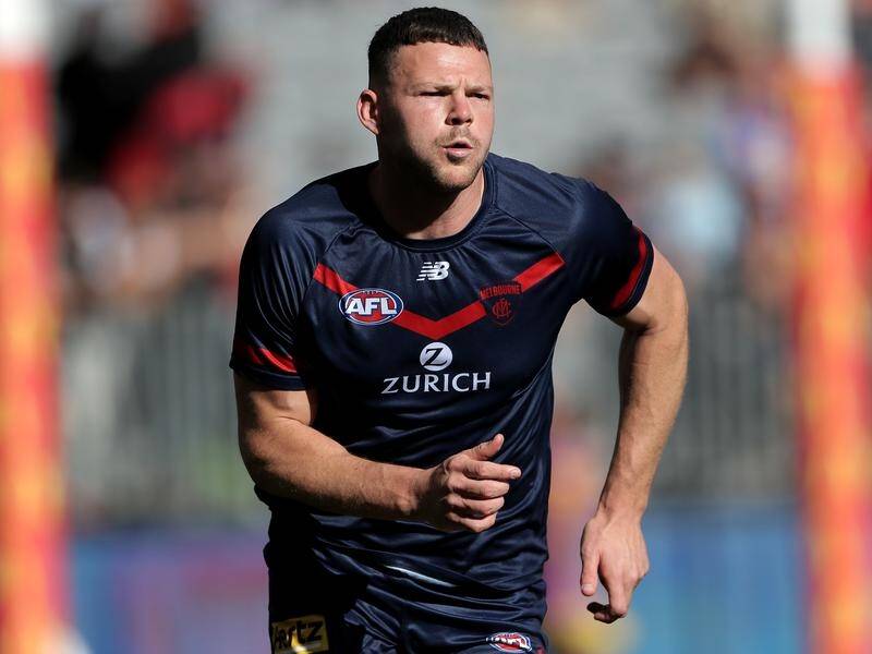 Melbourne's Steven May has overcome a hamstring injury and will play in the AFL grand final.