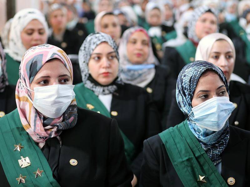 Nearly 100 women are sworn in as the first female judges in the Egypt's State Council.