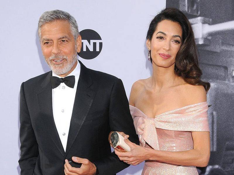 George Clooney and Amal Alamuddin Clooney at a Hollywood ceremony celebrating his achievements.