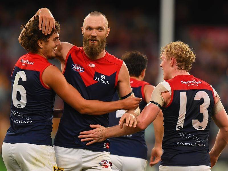 The Melbourne Demons booted eight last-quarter goals to thrash Hawthorn by 50 points at the MCG.