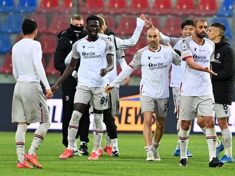 Bologna players celebrate after their tremendous 3-2 comeback win against bottom club Crotone.