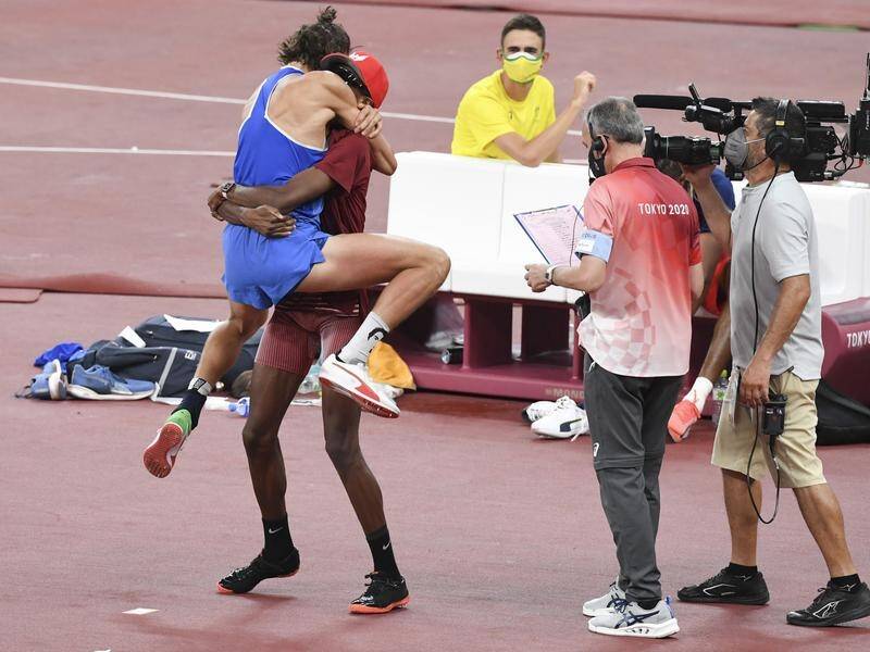 Gianmarco Tamberi (l) and Mutaz Essa Barshim celebrate their gold medal in the men's high jump.