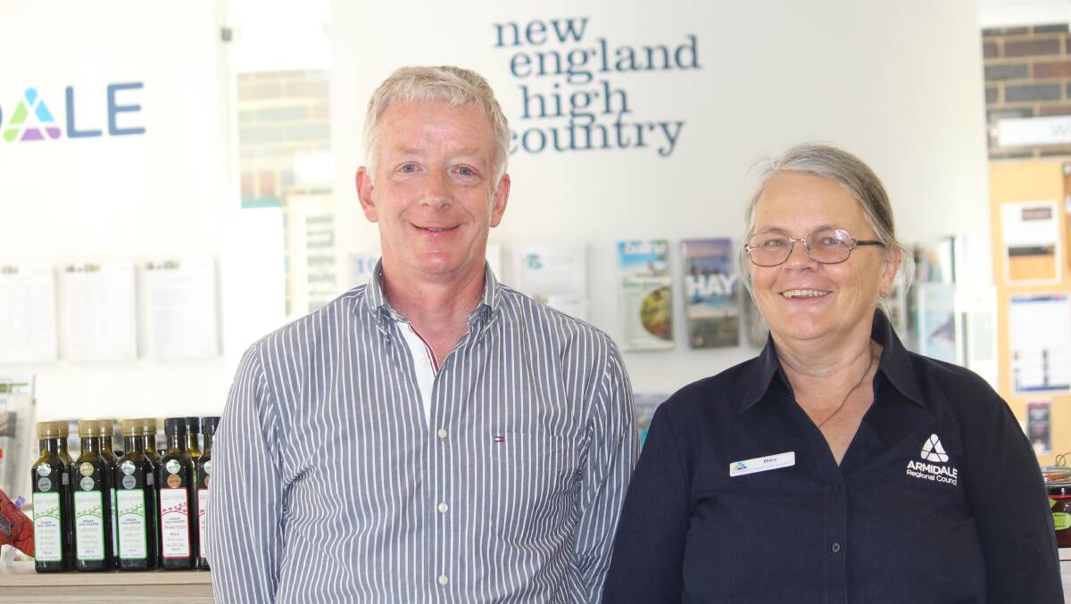 SELLING TOURISM: Tony Bloomfield with volunteer Bev Jenkins at the Armidale Regional Council Visitor Information Centre.