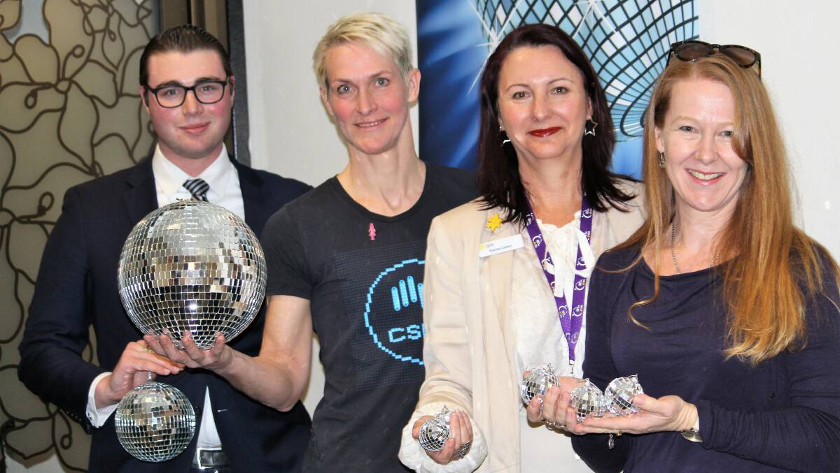 BALLS: Disco balls were all the go for (l-r) UNE's Hayden Gray, CSIRO acting research director - livestock Sonja Dominik, Cancer Council's Tracey Cullen and Colette Brazier from Australian Dance Enterprises when Stars of Armidale was launched.