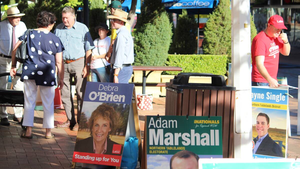 HUSKINGS: Candidates and representatives were busy on Tuesday morning outside the Armidale pre-poll station.