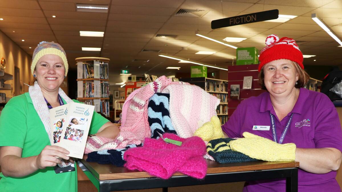 DISPLAY: Customer services officer Aimee Hutton and Guyra Library & Information officer Wendy Warner with some of the items on sale at the Guyra LT Starr Library.